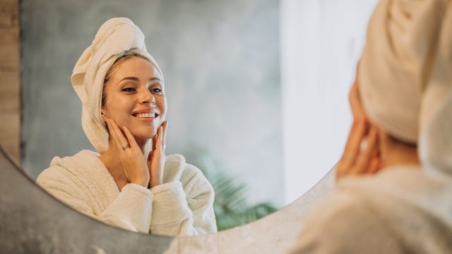 Woman Home Applying Cream Mask (1)