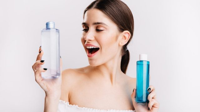 Attractive Girl With Dark Hair Poses White Wall Chooses What Kind Micellar Water Use