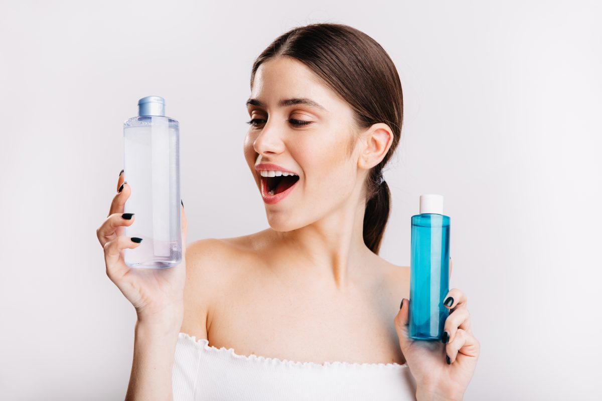 Attractive Girl With Dark Hair Poses White Wall Chooses What Kind Micellar Water Use