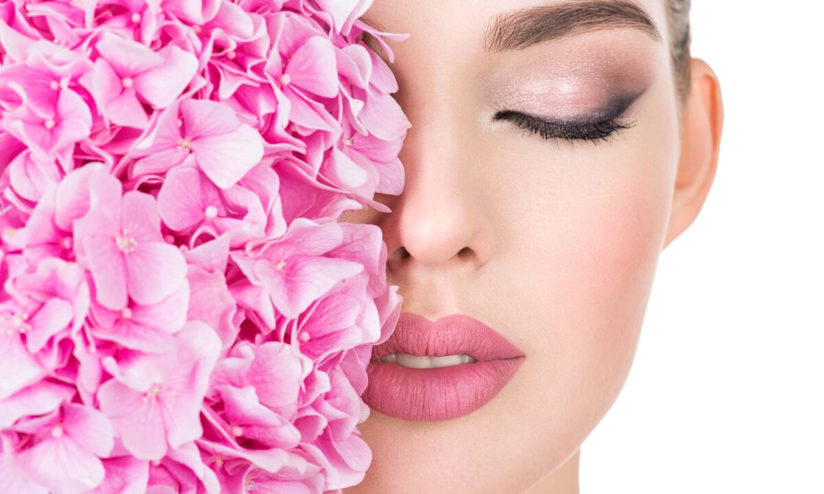Young Beautiful Woman With Flowers Near Face Min 1 E1675248230548 1200x720